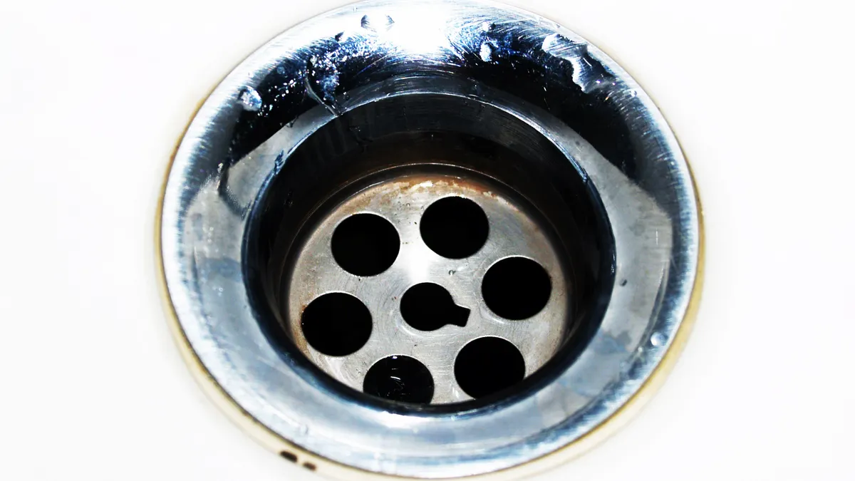 Close-up of a sink drain opening